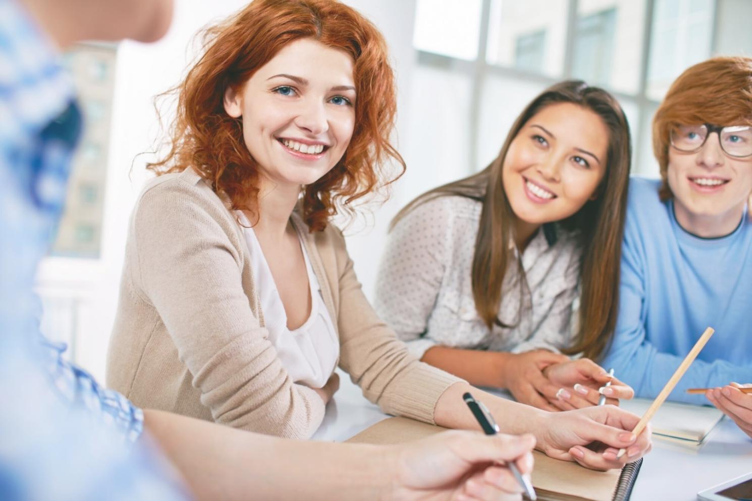 Students reviewing budget analysis documents together